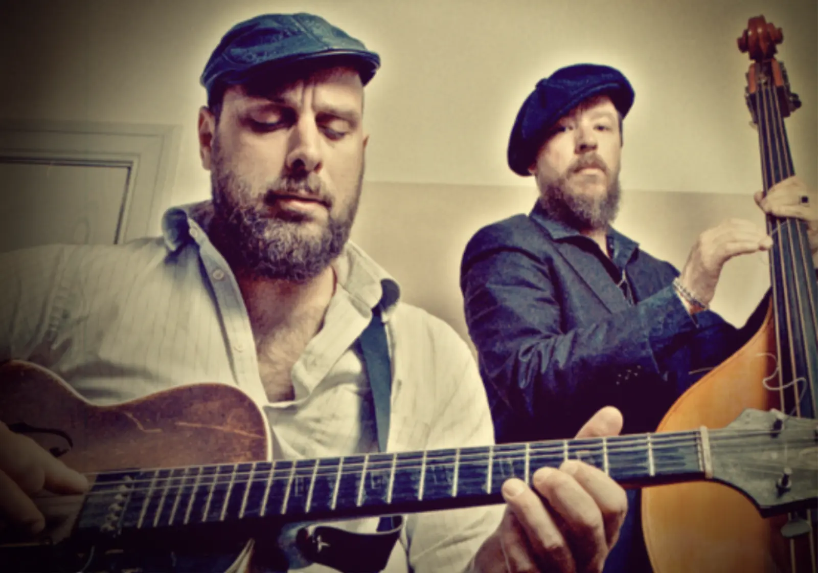 Big Creek Slim playing guitar with Rodrigo Mantovani on upright bass