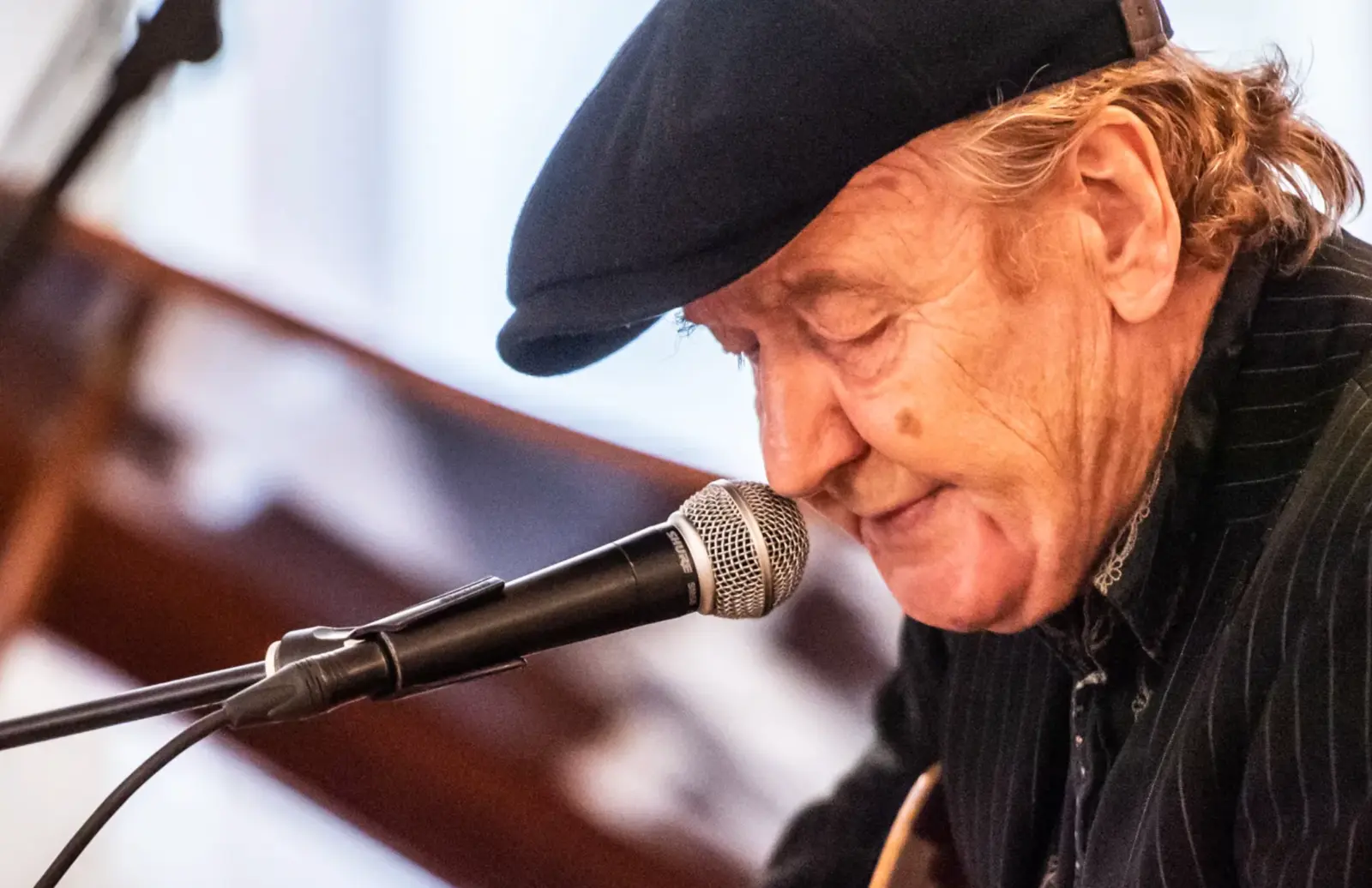 Troels Jensen singing into a microphone